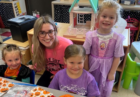 High School Teen Institute Member working with Elementary students