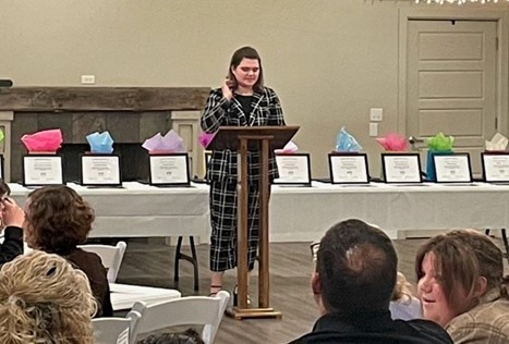 Student at podium at Coshocton County Youth Leadership Graduation Class of 2023.