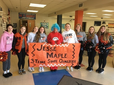 Students with congratulation sign for Jesse Maple - 3 time state qualifier 