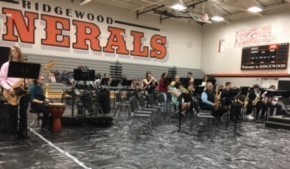 Jazz band performing in the high school gym.