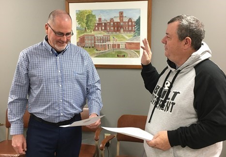 School Board member being sworn in as an officer.