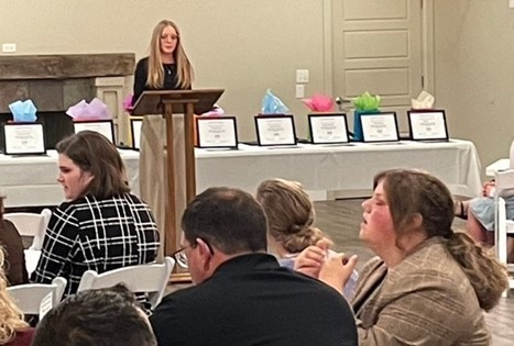 Student at podium at Coshocton County Youth Leadership Graduation Class of 2023.