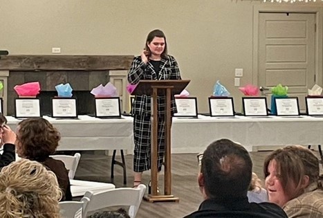 Student at podium at Coshocton County Youth Leadership Graduation Class of 2023.