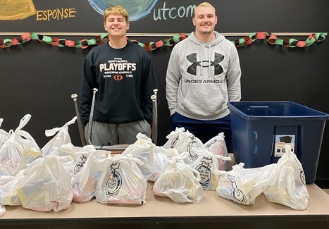 High School students filling blessing bags for community distribution.